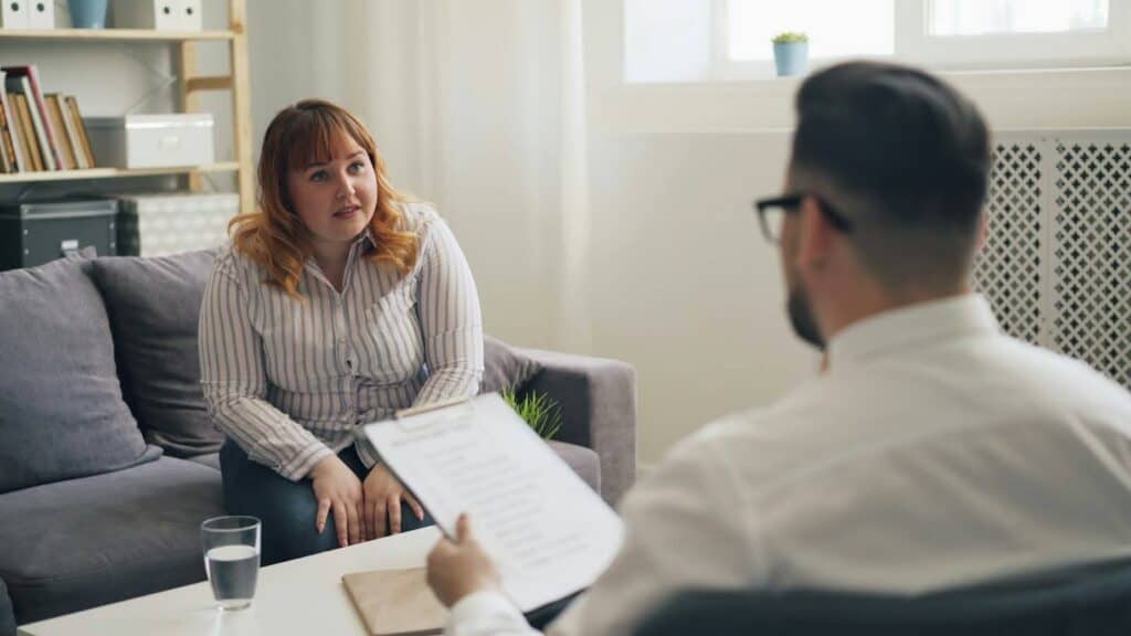 Tesla owner consulting with a lemon law attorney to understand refund and replacement rights under California consumer protection laws.