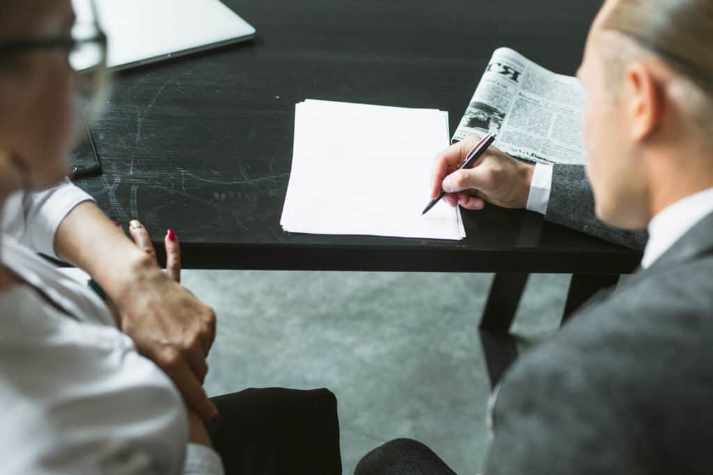 California lemon law attorney reviewing client’s defective vehicle case documentation.